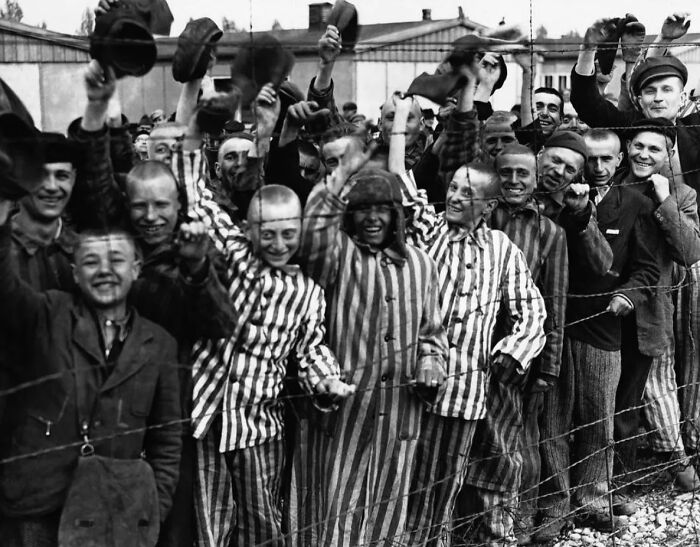 Prisoners At Dachau Concentration Camp Greet Their American Liberators From A Barbed-Wire Fence.(Germany, April 1945)