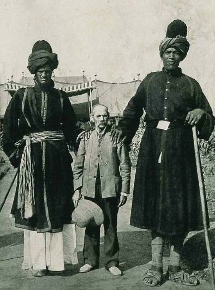 Two Kashmir Giants Posing With The American Photographer James Ricalton, 1903. One Of The Giants Was 7’9” Tall While The “Shorter” One Was A Mere 7’4” Tall