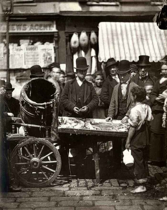 Costermonger Joesph Carney Sells Fresh Herring From His Barrow In The Market Of Seven Dials, London. 1877