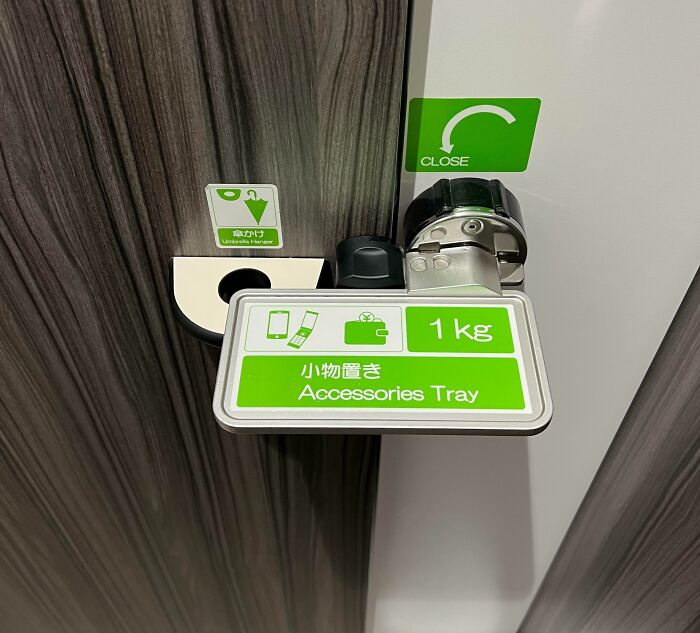 Door Latch That Doubles As An Accessories' Holder At A Public Restroom In Japan. Simple Concept, Straightforward Design, Elegant Execution
