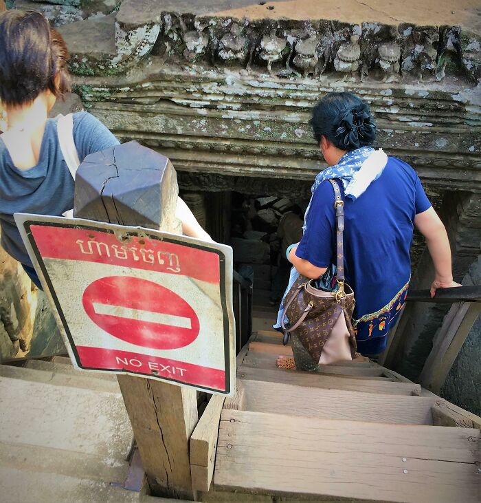 Tourists Accessing Restricted Areas In An Ancient Temple Near Angkor Wat