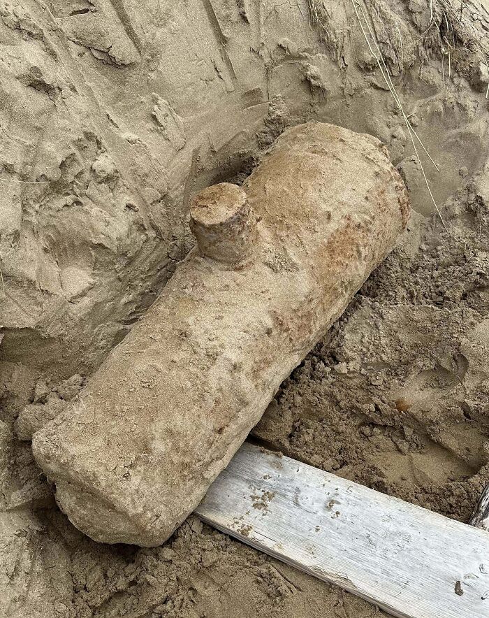 I Dug This Up While On Holiday In Devon, UK. Only The Protruding Cylindrical Part Was Visible And It Was Found ~7m Up A Sand Dune. It Is Solid Metal (Most Likely Iron) And Roughly A Metre In Length. It Didn’t Seem Hollow And Was Unbelievably Heavy. Any Ideas?