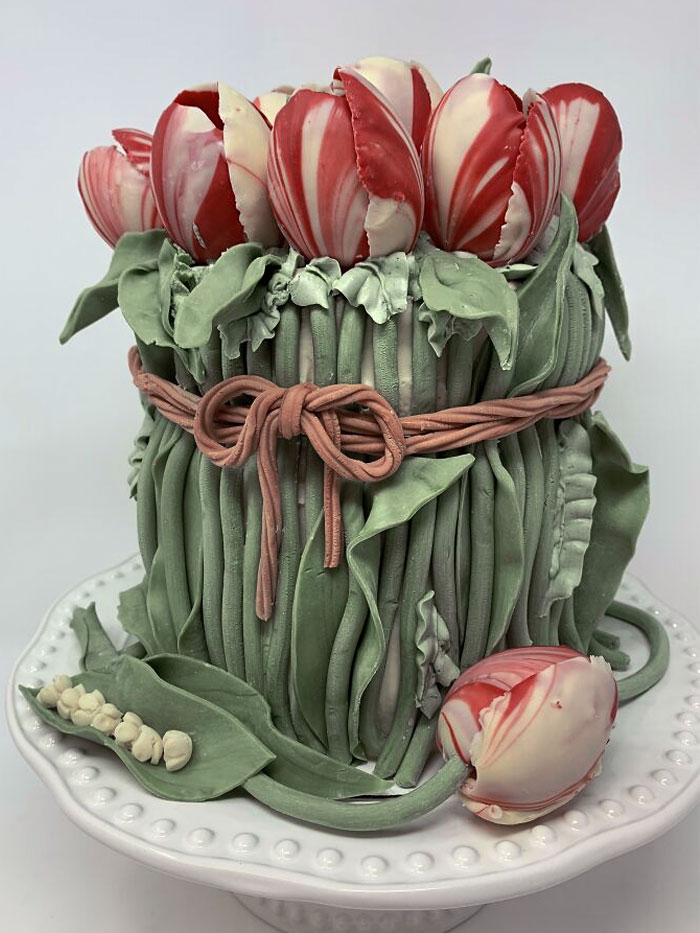 Inside, Strawberry Cake With Italian Meringue Buttercream. Outside, The Stems And Leaves Are Homemade Modeling Chocolate. The Tulips Are Colored And Tempered With White Chocolate