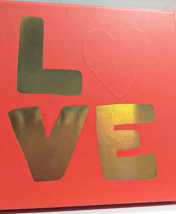 The "O" In The Word "Love" On This Box Has Been Replaced By A Barely Visible Heart