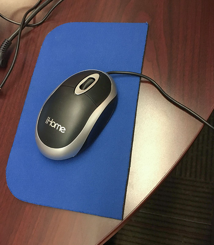 My School Cuts The Mouse Pads In Half To Save Money