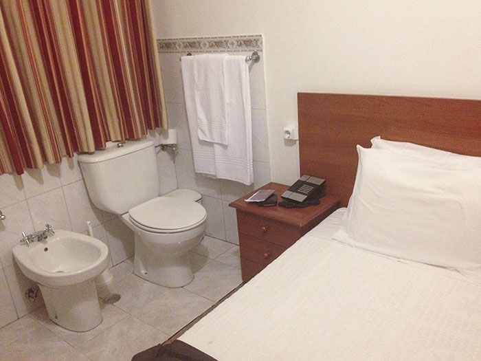 Booked A Cheap Hotel In Lisbon With A Friend. The Pictures On The Booking Website Never Showed The Toilet And The Bed In The Same Picture
