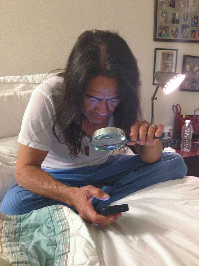 Walked In On My Dad Using A Magnifying Glass To Read Text On His iPhone
