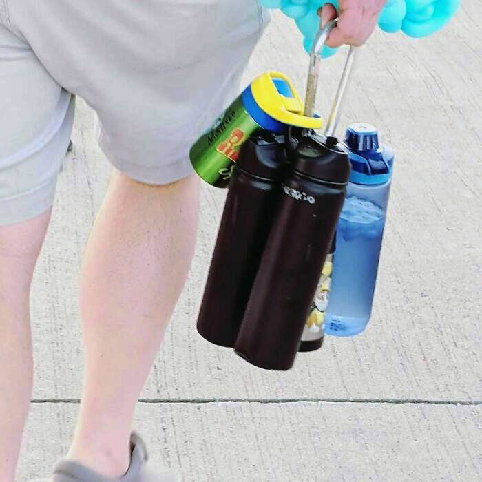 Genius Using A Stroller Bag Hook To Carry All Of The Kids' Water Bottles And Sippy Cups