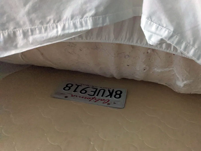 I'm Staying In A Hotel Room And Found This License Plate Hidden Under The Mattress