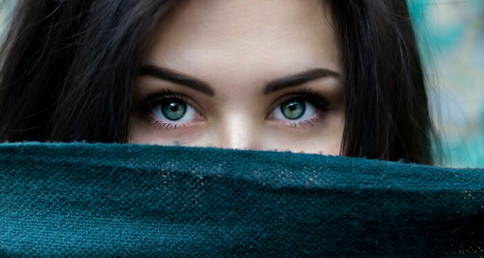 A close up of a person with blue eyes