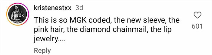 Social media comment referencing Megan Fox's sleeve tattoo, MGK style, pink hair, chainmail, lip jewelry. Social media comment referencing Megan Fox's sleeve tattoo, MGK style, pink hair, chainmail, lip jewelry.