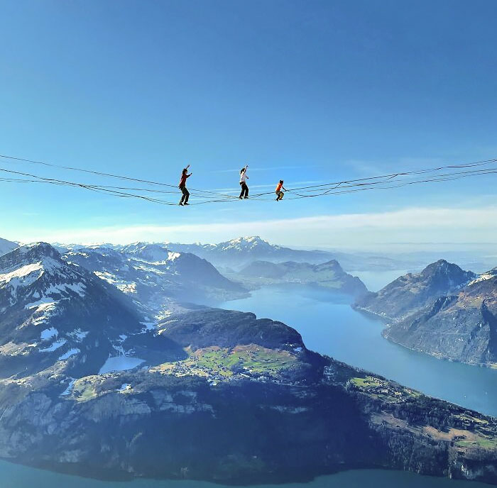 3 Highliners At Fronalpstock, Stoos. Lake Of Luzern In The Background