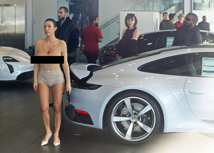 Bianca Censori Goes Porsche Shopping With Kanye West While Wearing An All-Nude Set