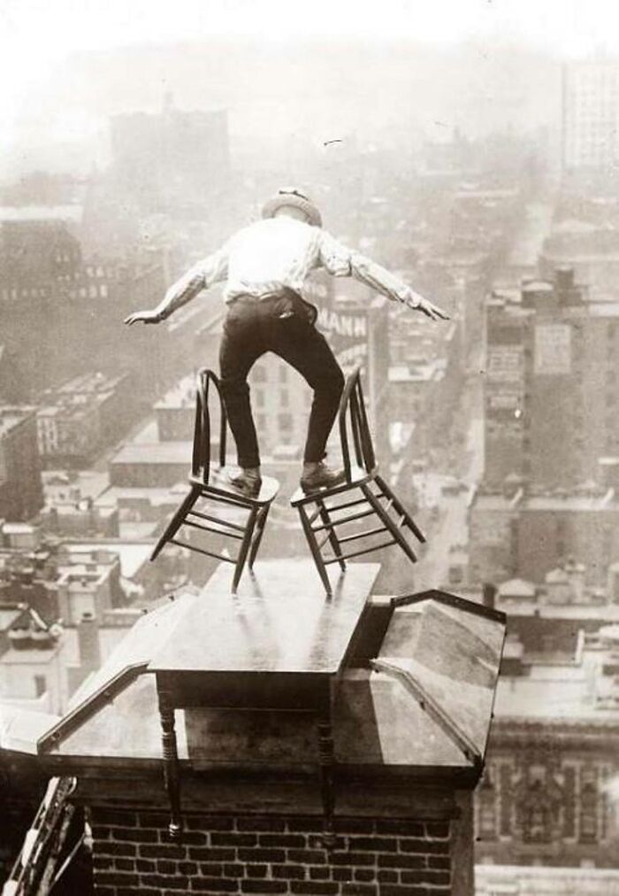 Balancing Act On Chimney Of 22 Story Building In NYC, 1920s