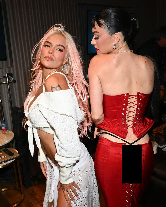 Singer Katy Perry in a red corset shows butterfly tattoo and thong at Billboard Women in Music Awards 2024 event. Singer Katy Perry in a red corset shows butterfly tattoo and thong at Billboard Women in Music Awards 2024 event.