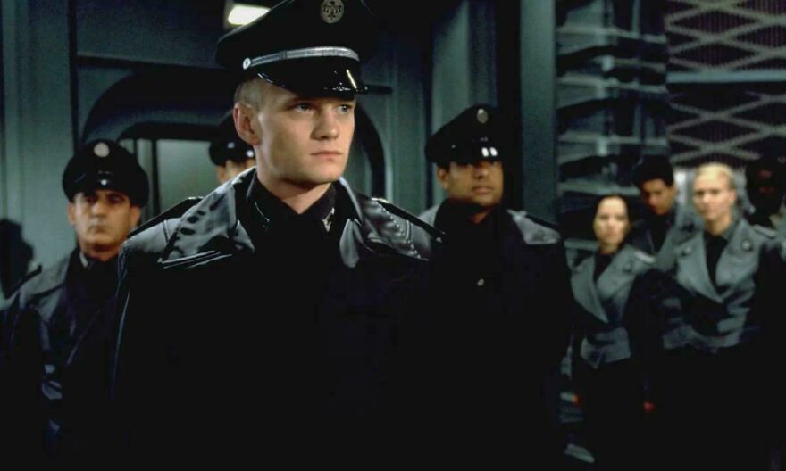 In Starship Troopers (1997) Neil Patrick Harris Dresses Like This. This Is A Shows How This Is Just A Film About Cool Good Looking Humans Fighting Ugly And Obviously Evil Alien Bugs, With No Other Meaning Behind It