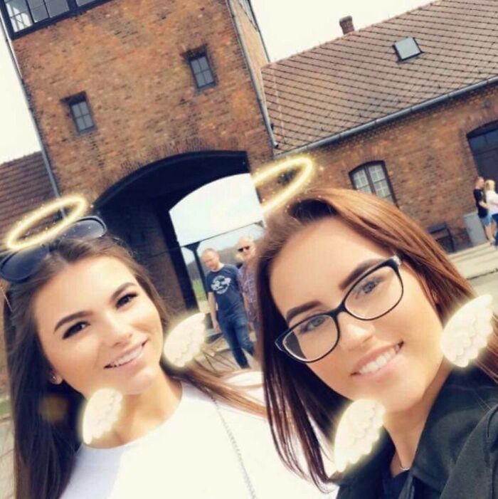 Taking Selfies With Filters On Outside Auschwitz