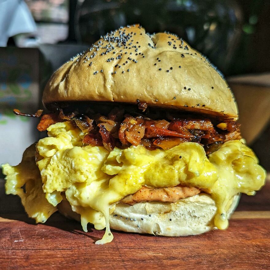Breakfast Sandwich: Fresh Kaiser Roll, Egg, Truffle Gouda, Hickory Smoked Bacon, Caramelized Onions, Roasted Jalapenos & Tomatoes, And Pub Sauce
