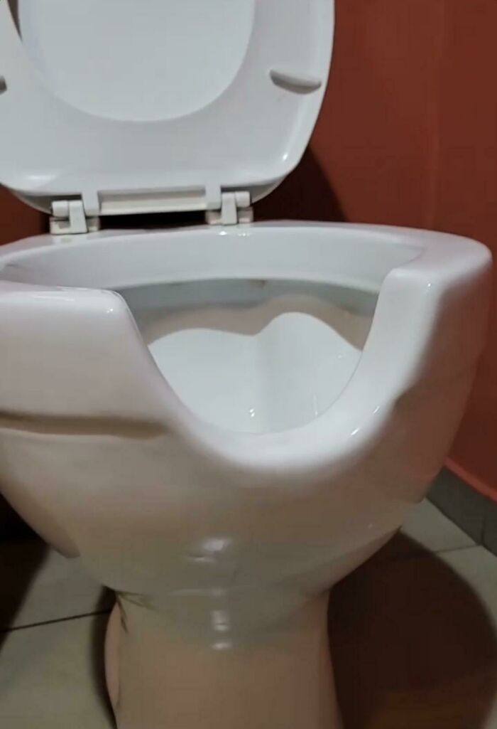 Toilet With A U-Shaped Divot In The Front