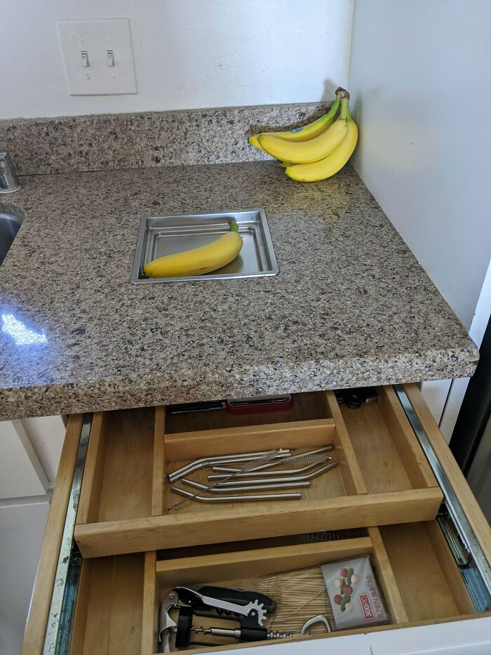 Staying At An Airbnb And We Have This Little Metal Tray Embedded In The Counter Top. It's About An Inch Deep (Banana For Scale), Cannot Be Removed, And Has A Drawer Underneath