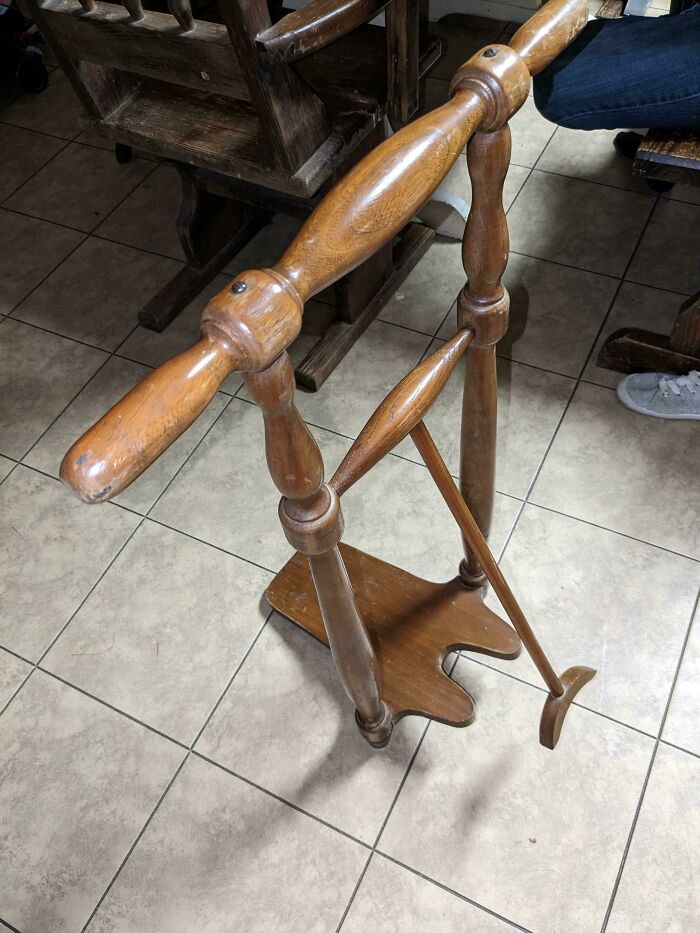 This Is About 3ft Talk Made Of Solid Wood. It Doesn't Weigh Much Though, Maybe 5 Or 10 Lbs. The Arm Hanging Down Swings And The Top Is Just A Handle. It Does Not Move