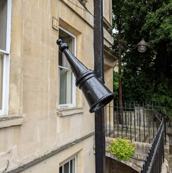 Iron Cone On Either Side Of A Gate Outside The Entry To A Building In Bath England
