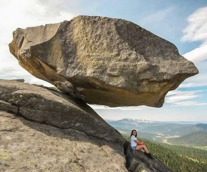 An Incredible Hanging Stone In The Sayan Mountains In Siberia