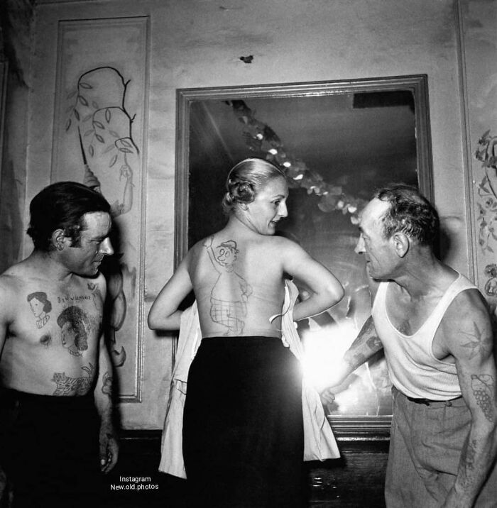 People Show Off The Tattoos Given To Them During An Amateur Tattoo Artist Contest In France In 1950 . Photographer Robert Doisneau