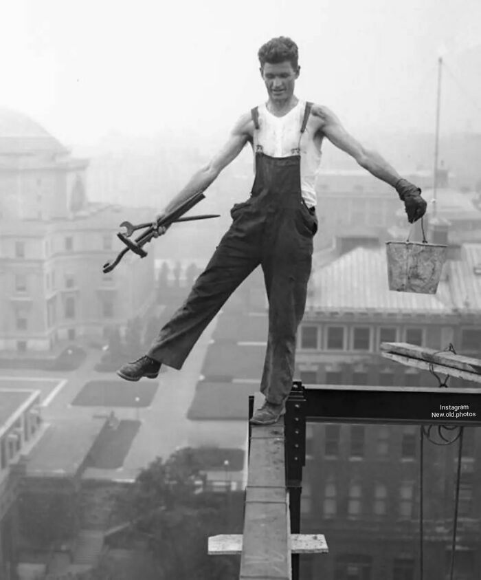 An Iron Worker Balances Himself On A Beam 15 Floors High. Ge Building , Rockefeller Center , 1932 Photographer Charles Clyde Ebbets