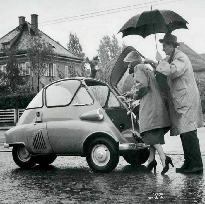 A Couple Gets Into Their Bmw Isetta Through The Front Door. (1950)