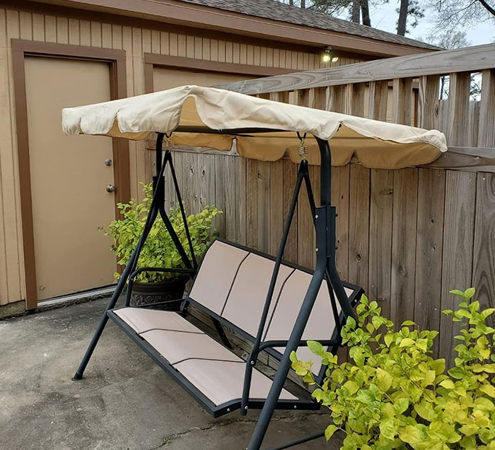  A 3-Person Patio Canopy Swing Chair That's Durable, Adjustable And Perfect For Those Chill, Swing-Back-And-Forth Kinda Days