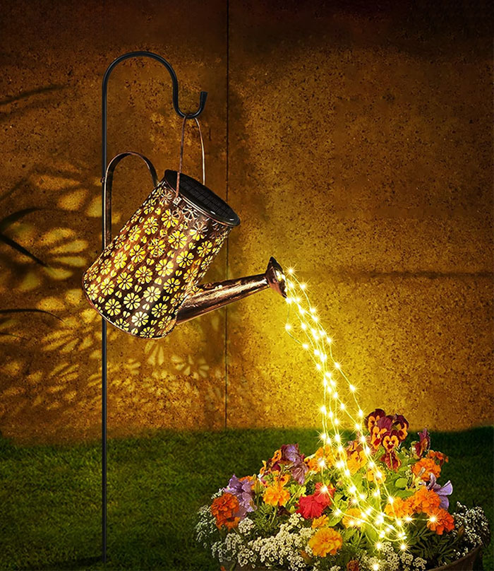  A Solar Watering Can With Lights That'll Sprinkle Your Nights With Bright Joy And Keep Your Garden Shining