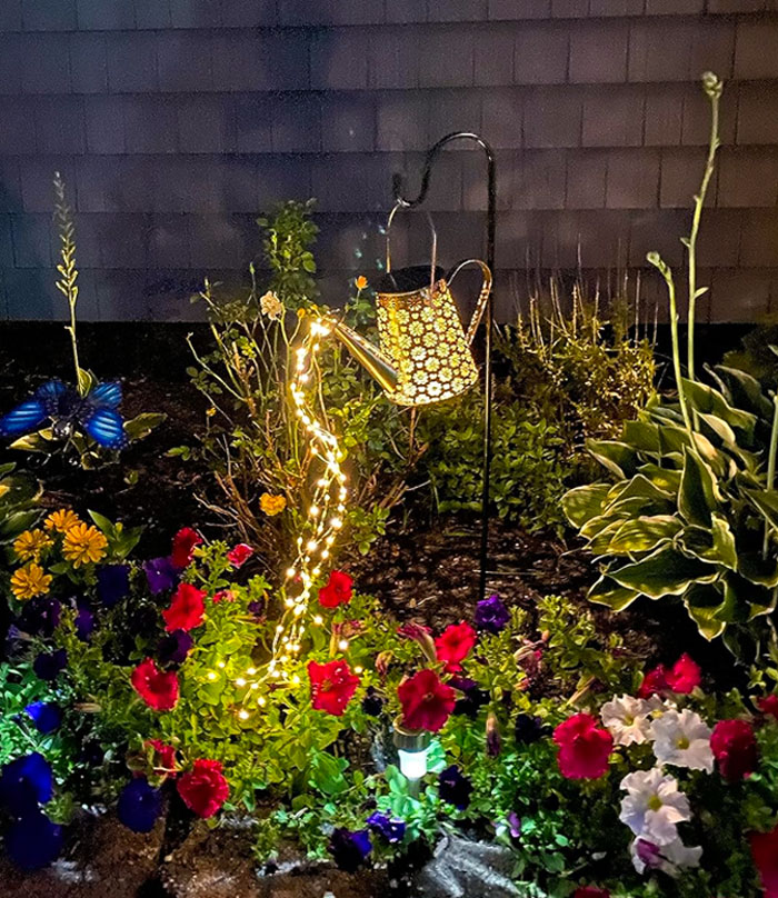  A Solar Watering Can With Lights That'll Sprinkle Your Nights With Bright Joy And Keep Your Garden Shining