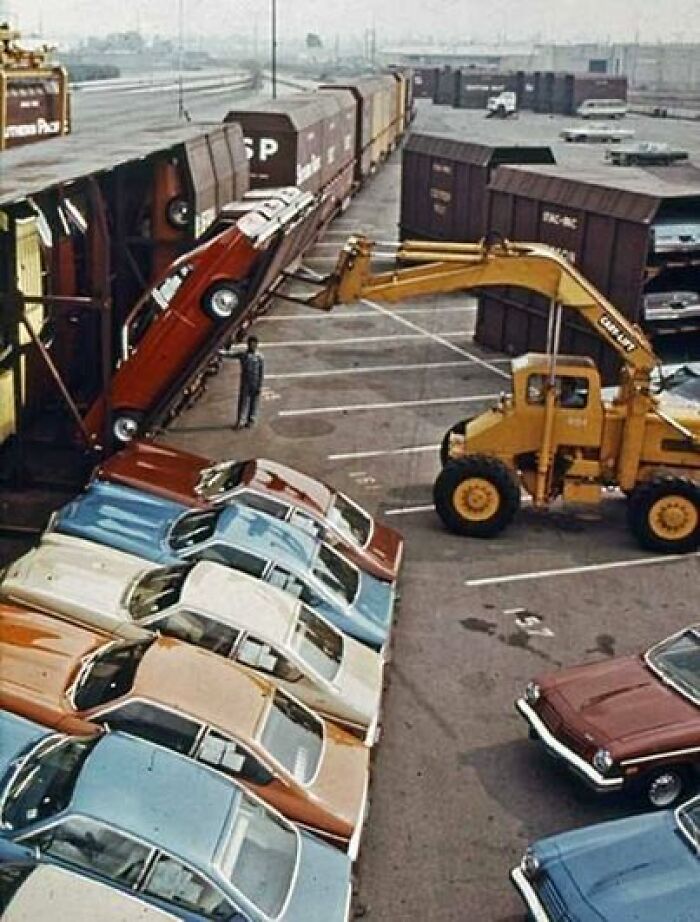 Loading Southern Pacific's Specially Designed Vert-A-Pac Railroad Cars With The Mighty Chevy Vega, Lordstown, Ohio, 1974