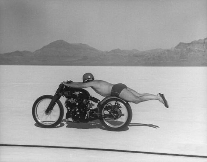 Motorcycle Racer Roland Free Lies Horizontally On His Bike As He Breaks The World Speed Record On Utah's Bonneville Salt Flats On September 13, 1948