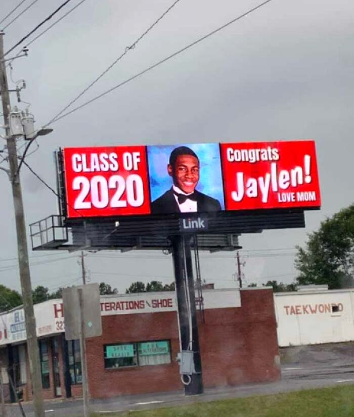 Friend Couldn't Walk Down The Stage For Graduation Because Of Social Distancing, So His Mom Bought A Billboard Sign For Him Instead