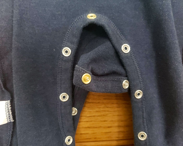 The Middle Snap On My Baby's Onesie Is A Different Color To Help Align The Buttons