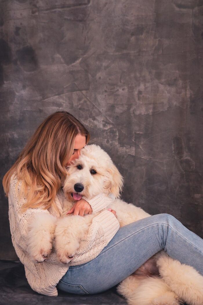 Labradoodle Remy Melts Into Mum's Arms For A Cute Embrace
