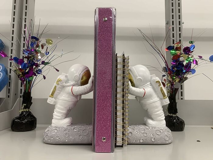 Keep Your Bookshelf Grounded With These Cosmic Astronaut Bookends