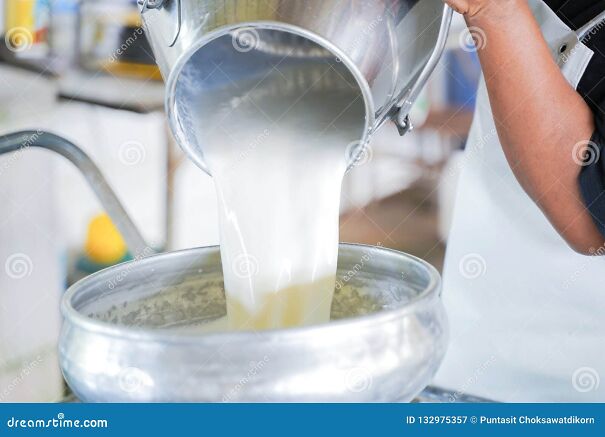worker-pouring-milk-container-tank-transform-worker-pouring-milk-container-tank-transform-132975357.jpg