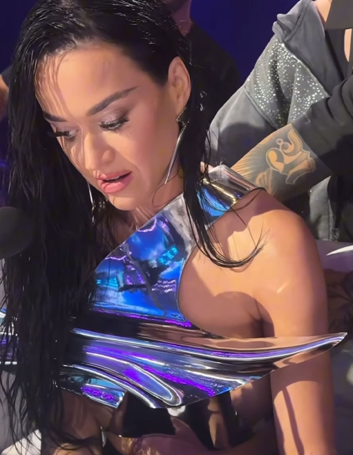"Ratings, Here We Come": Katy Perry Holds Pillow And Hides Under Desk During Wardrobe Malfunction On Live Show