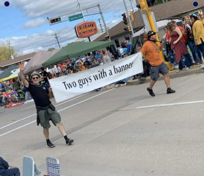 Two Guys With A Banner
