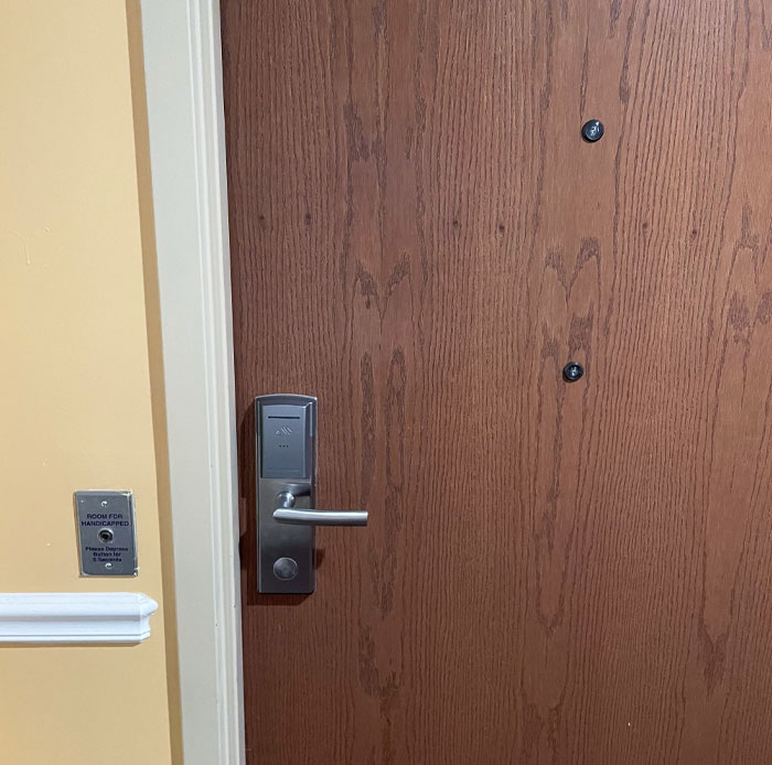 This Hotel Room Door Has A Second Peephole For Handicapped People