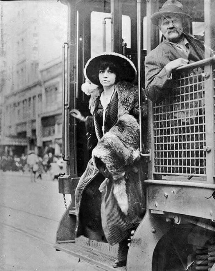 A Fashionable Young Woman Exiting A NYC Streetcar In 1912