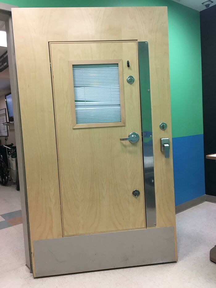 Door In The Emergency Room Has A Smaller Door In It To Prevent Patients From Barricading Door