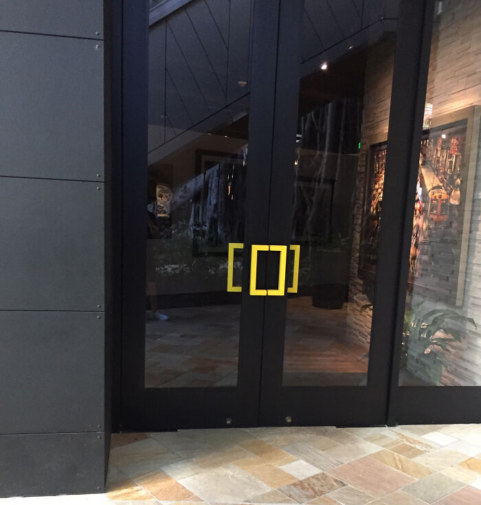 Nation Geographic Gallery Uses Its Logo As A Door Handle
