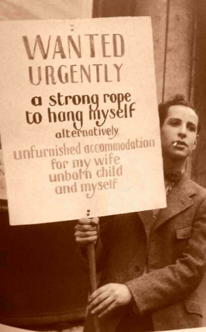 An Unemployed Man Holding A Troubling Sign During The Great Depression, 1932