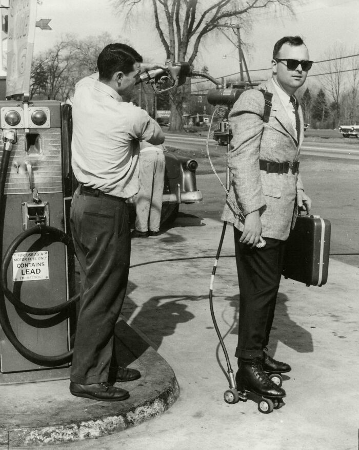 A Salesman Has His Motorized Roller Skates Refueled. Connecticut, 1961