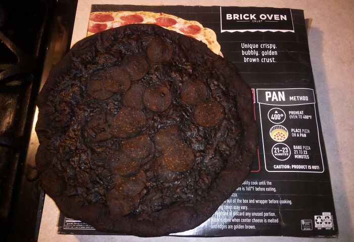 You Go To Preheat Your Oven For Your Frozen Pizza, And Open Up The Oven Door Only To Find This "Pizza" Inside. A "Unique Crispy, Bubbly, Golden Brown Crust" Is Right
