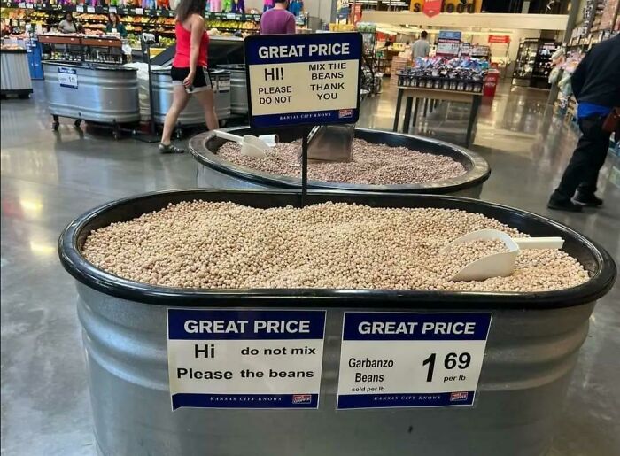 Store sign fail with mixed messages about garbanzo beans, creating confusion for shoppers.